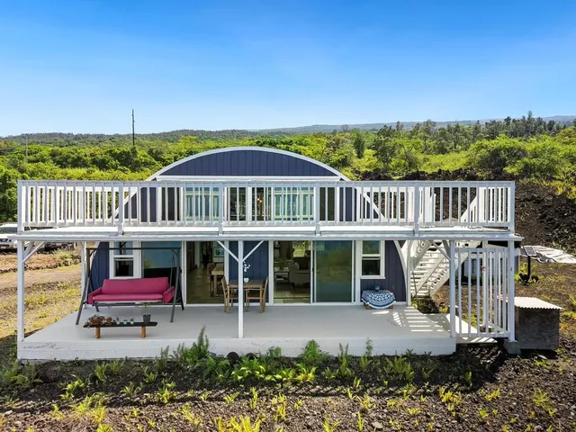 a view of a house with a yard balcony
