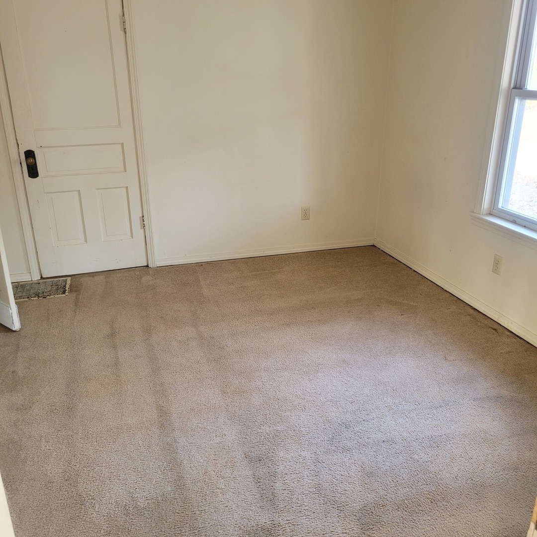 509 Lucier Street Murphysboro, IL 62966 - Photo 4 of 14 an empty room with windows