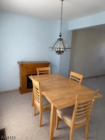 a dining room with a table and chairs