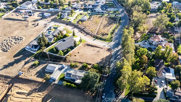 an aerial view of a residential houses with outdoor space