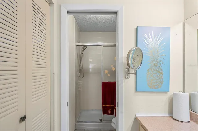 a bathroom with a mirror and a shower