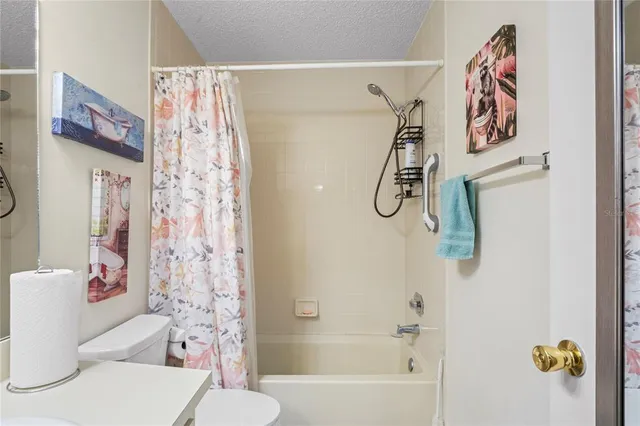 a bathroom with a shower curtain
