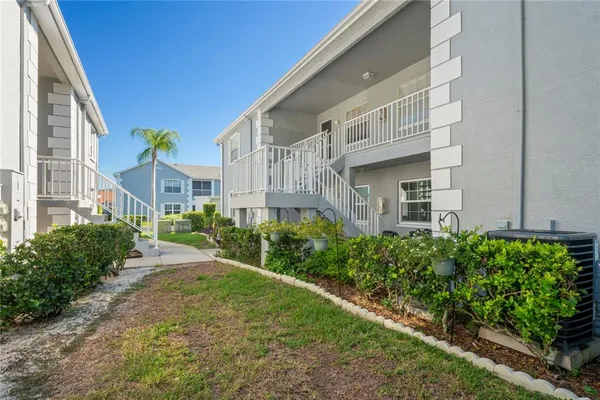 a view of a brick building next to a yard
