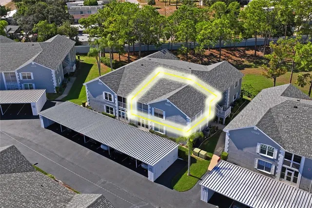 an aerial view of a house with a garden