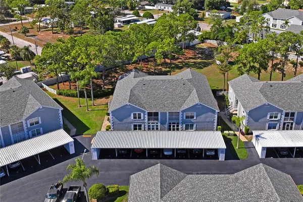 an aerial view of a house with a garden and plants