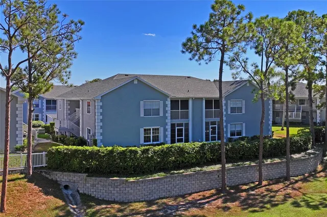an aerial view of a house a yard and outdoor seating