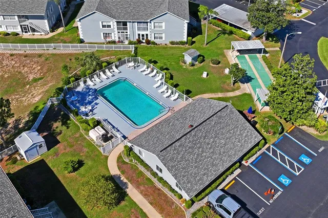 an aerial view of multiple houses with yard