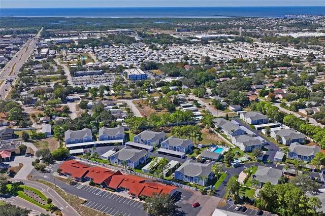 an aerial view of multiple houses with outdoor space
