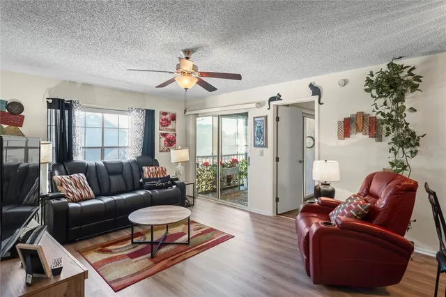 a living room with furniture rug and window