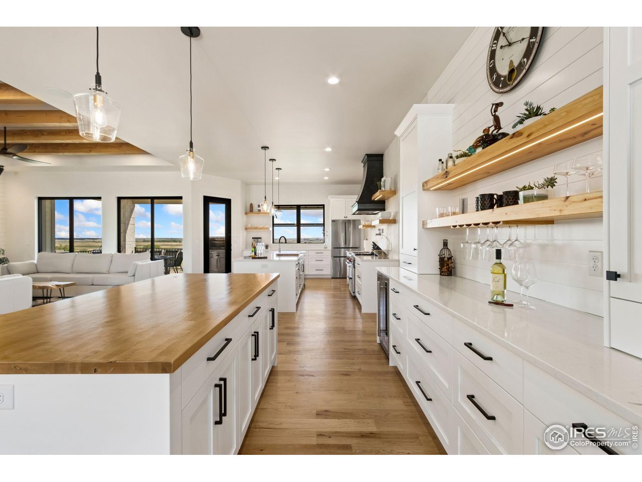 3802 Bridle Ridge Circle Severance, CO 80524 - Photo 12 of 50 a large kitchen with stainless steel appliances lots of counter space and windows