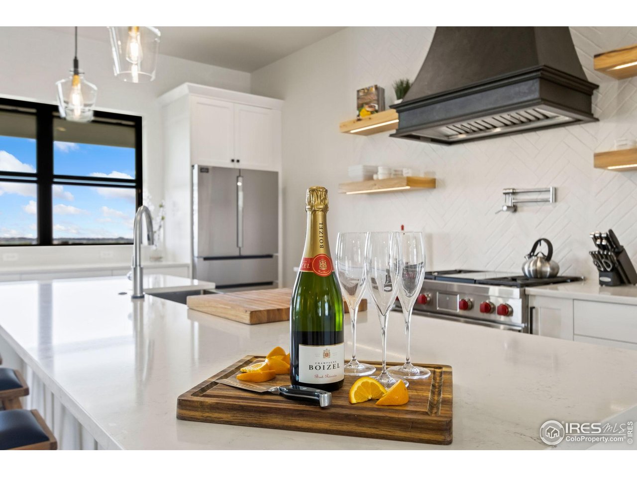3802 Bridle Ridge Circle Severance, CO 80524 - Photo 15 of 50 a kitchen with a stove and a sink