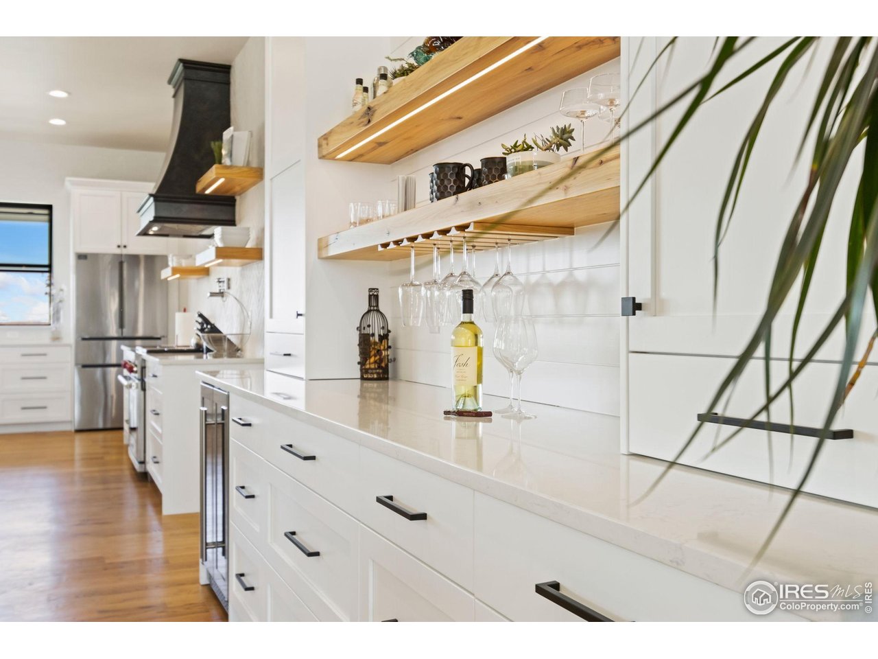 3802 Bridle Ridge Circle Severance, CO 80524 - Photo 16 of 50 a kitchen with stainless steel appliances granite countertop a refrigerator and a stove