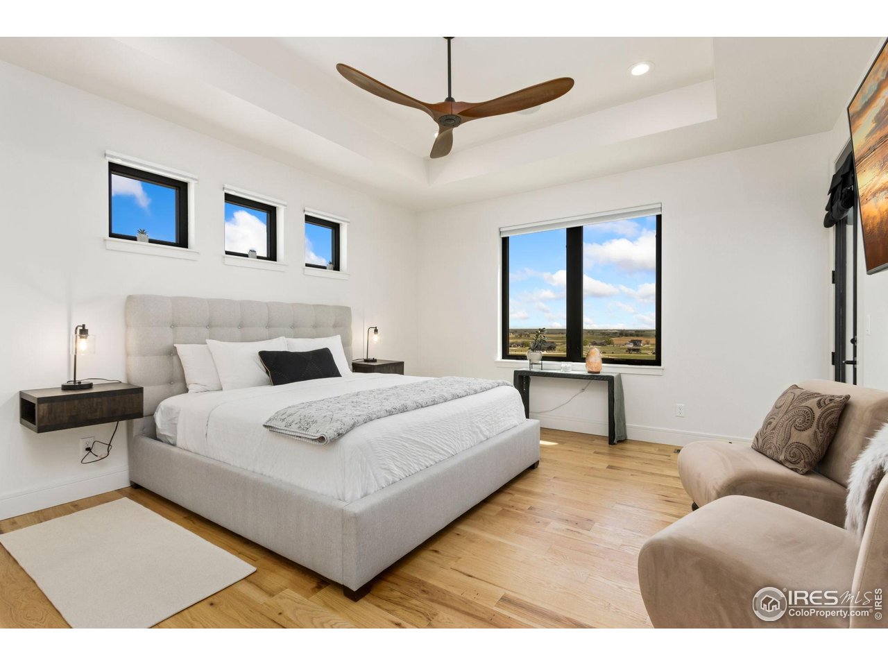 3802 Bridle Ridge Circle Severance, CO 80524 - Photo 18 of 50 a bedroom with a bed and a couch