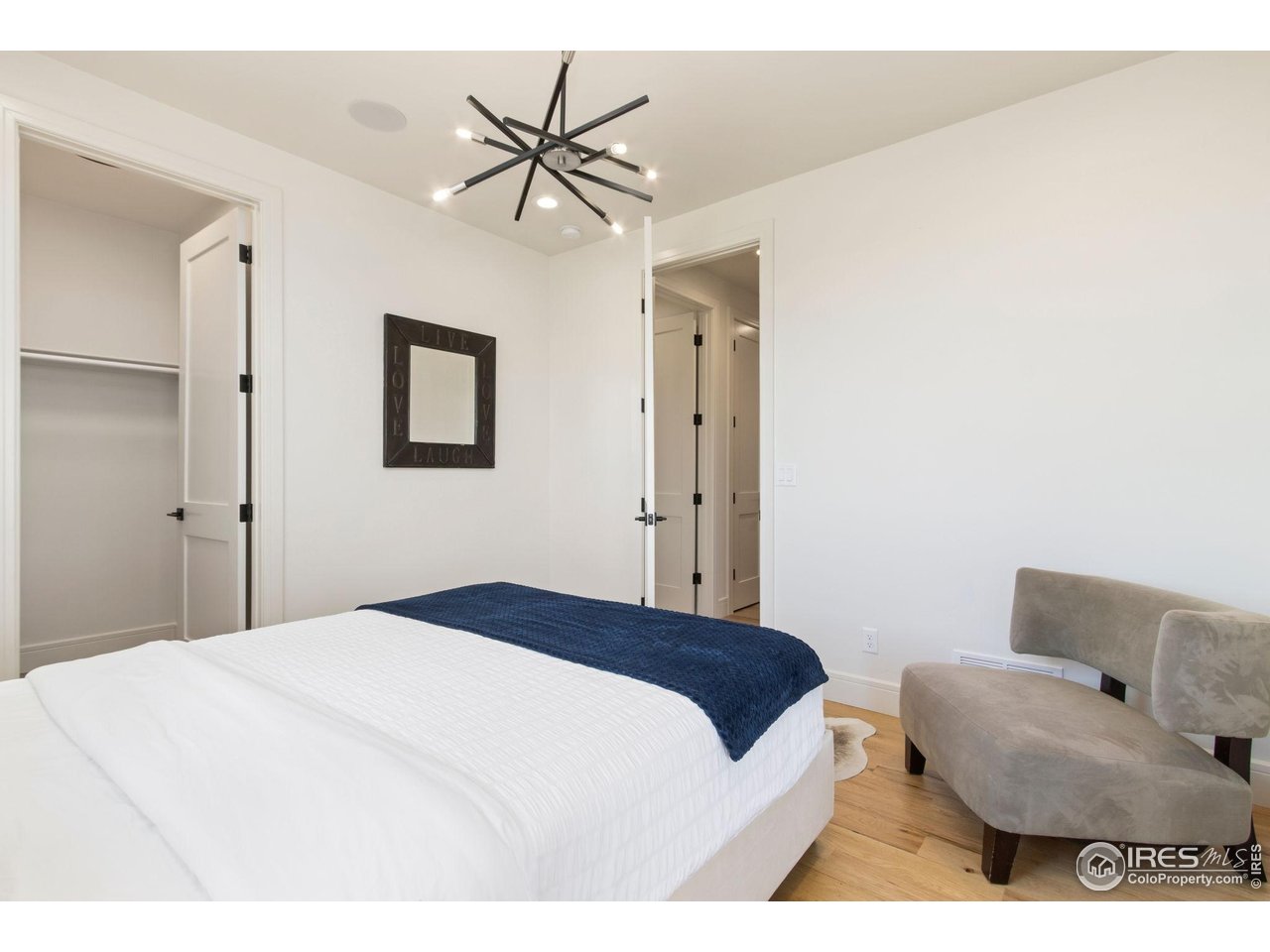 3802 Bridle Ridge Circle Severance, CO 80524 - Photo 24 of 50 a bedroom with a bed and a couch