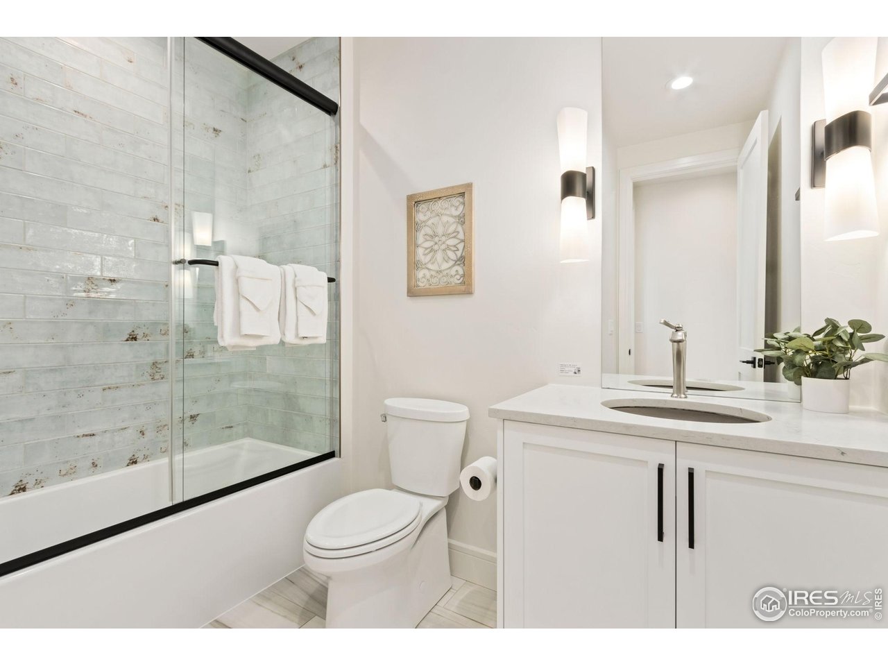 3802 Bridle Ridge Circle Severance, CO 80524 - Photo 25 of 50 a bathroom with a sink a toilet and shower