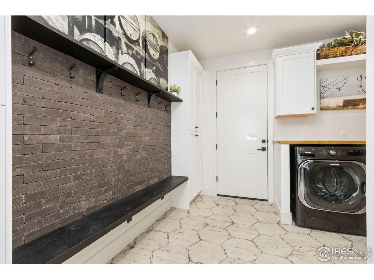 3802 Bridle Ridge Circle Severance, CO 80524 - Photo 26 of 50 a view of a hallway with washer and dryer