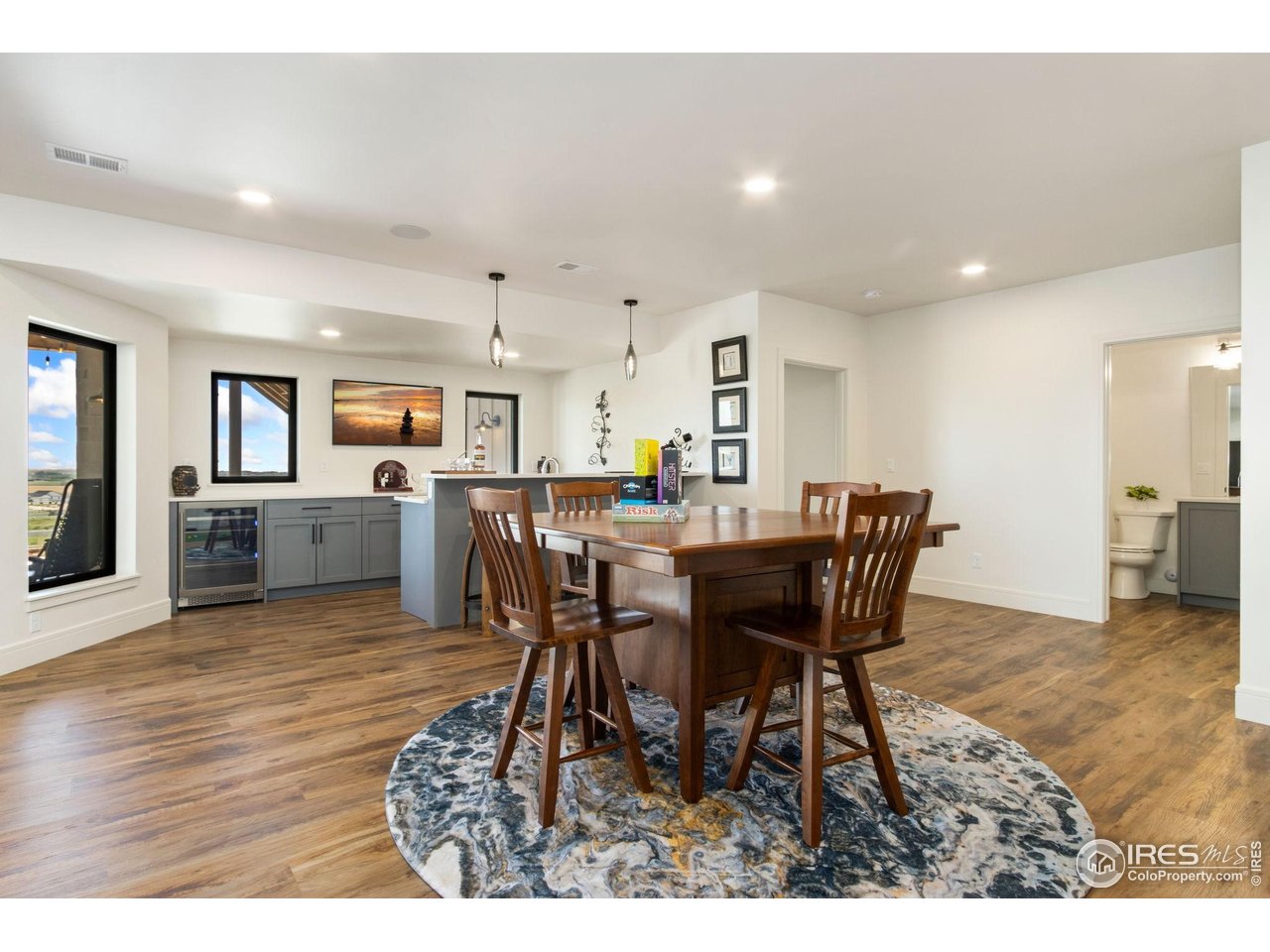 3802 Bridle Ridge Circle Severance, CO 80524 - Photo 30 of 50 a view of a dining room with furniture and wooden floor