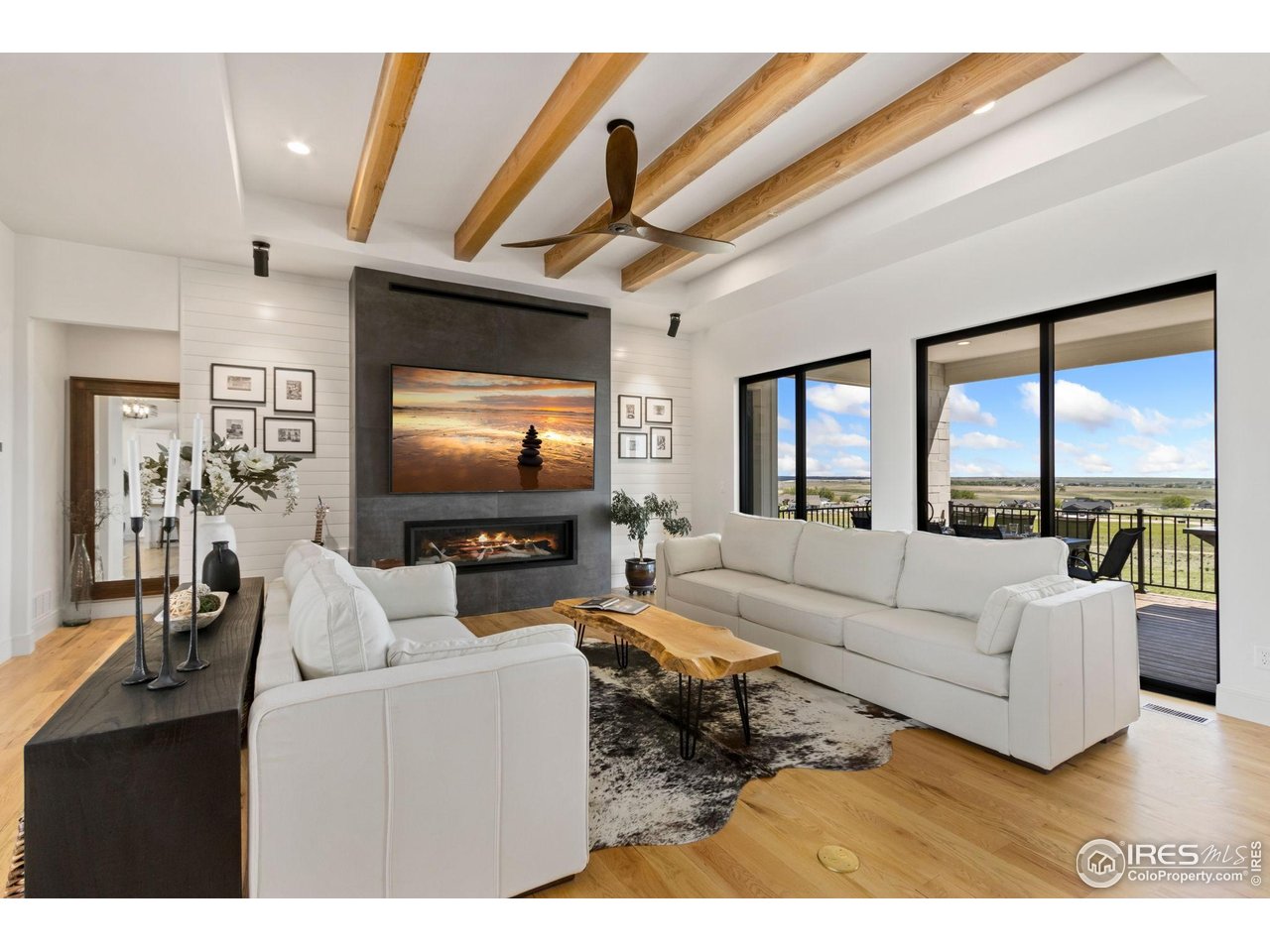 3802 Bridle Ridge Circle Severance, CO 80524 - Photo 3 of 50 a living room with furniture and a flat screen tv