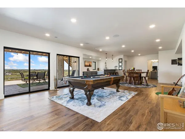 a room with lots of furniture and view of living room