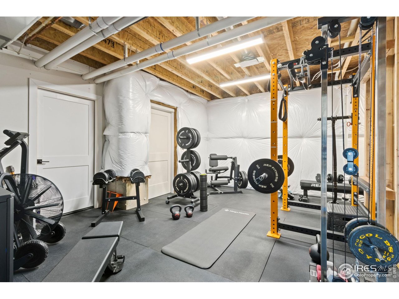 3802 Bridle Ridge Circle Severance, CO 80524 - Photo 40 of 50 a view of a room with gym equipment