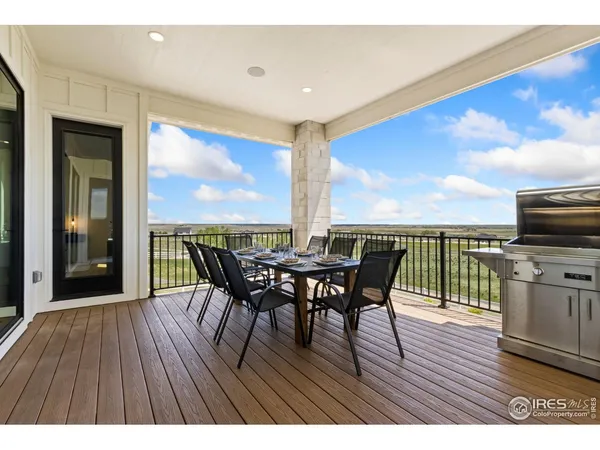 a view of a patio with a table and chairs
