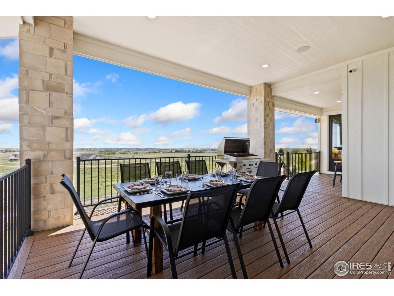 3802 Bridle Ridge Circle Severance, CO 80524 - Photo 43 of 50 a view of a dining room with furniture and wooden floor