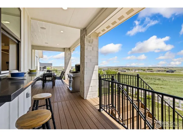 a view of a balcony with chairs