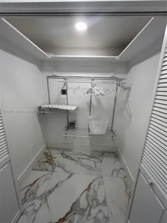 a view of a room with rack on the wall