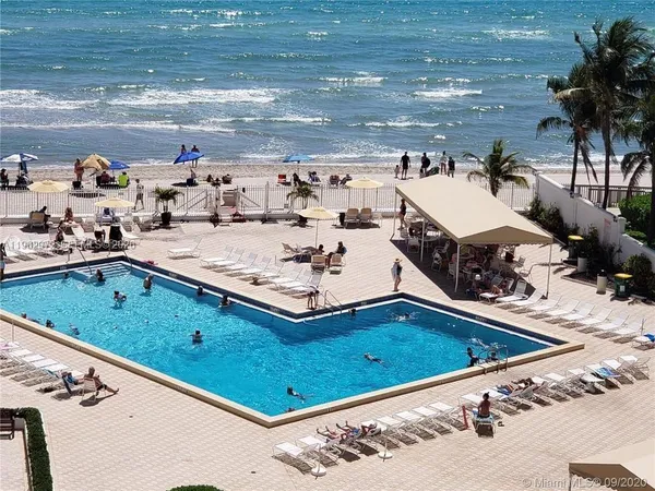 a view of a swimming pool with a patio