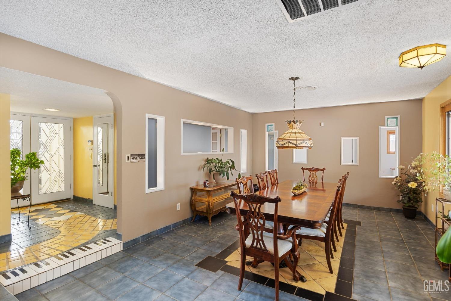 Undisclosed Address Bakersfield, CA 93306 - Photo 17 of 41 a view of a livingroom with furniture and a dining table