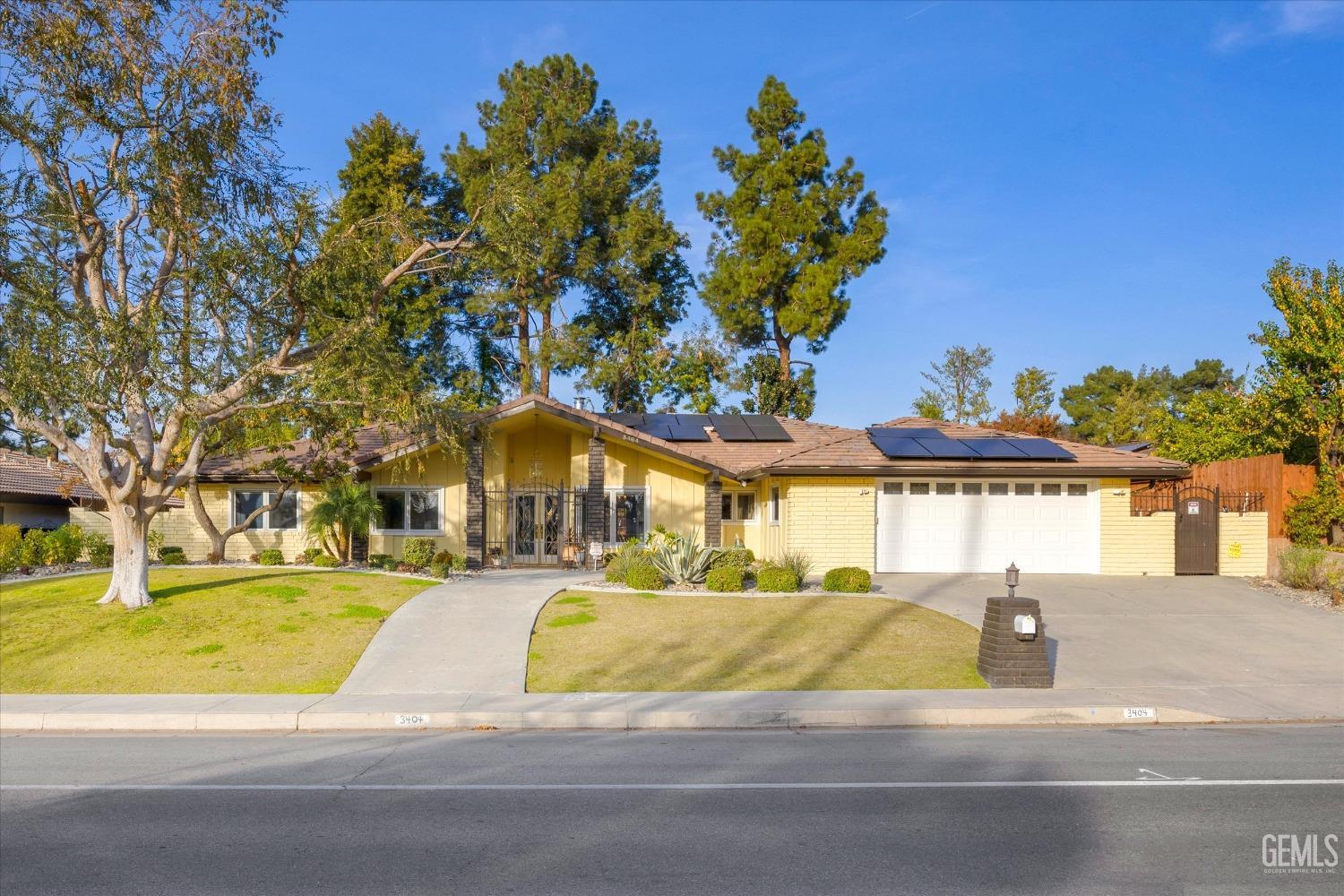 Undisclosed Address Bakersfield, CA 93306 - Photo 2 of 41 a view of swimming pool with an outdoor space and seating area