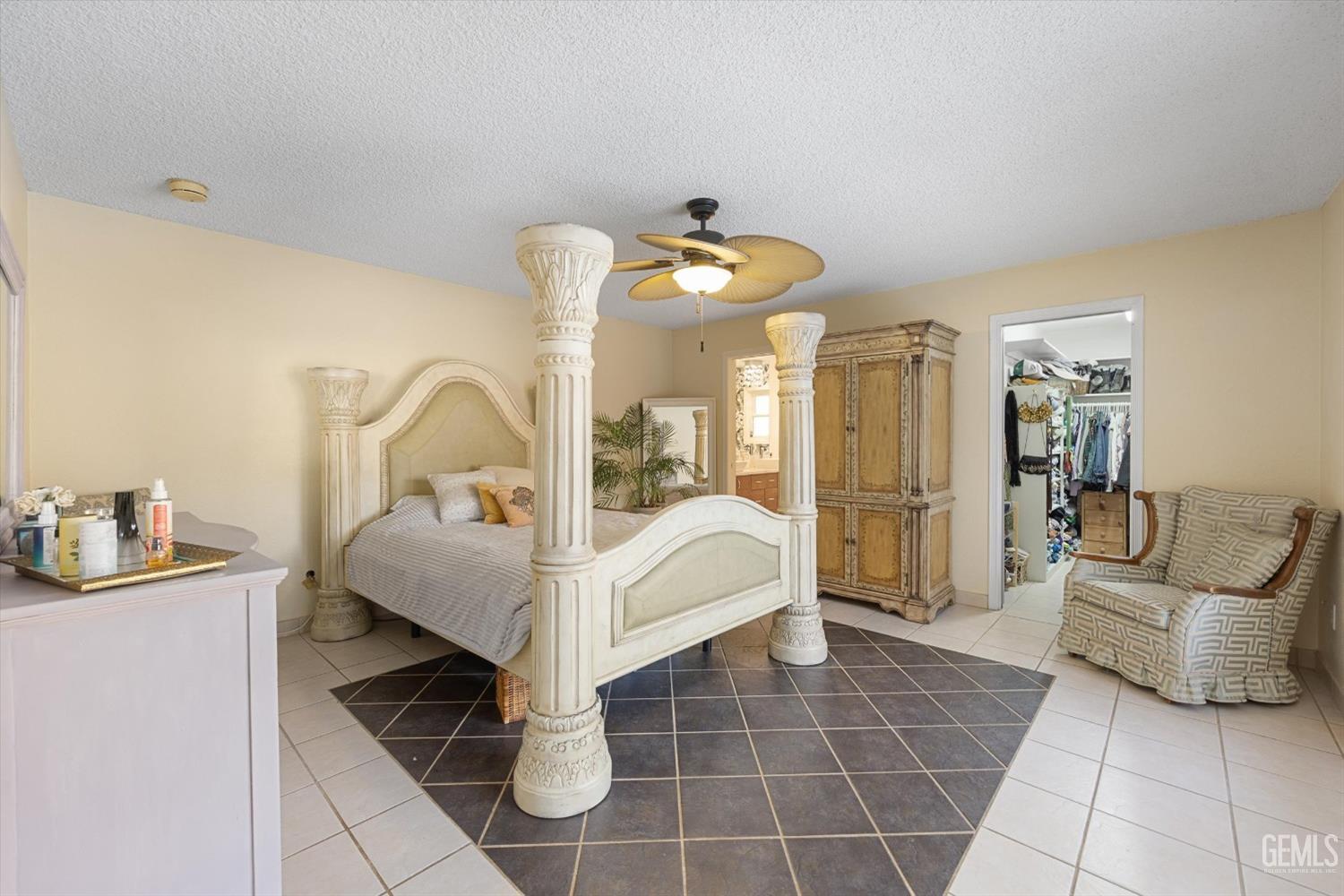 Undisclosed Address Bakersfield, CA 93306 - Photo 23 of 41 a bed room with a bed and a mirror