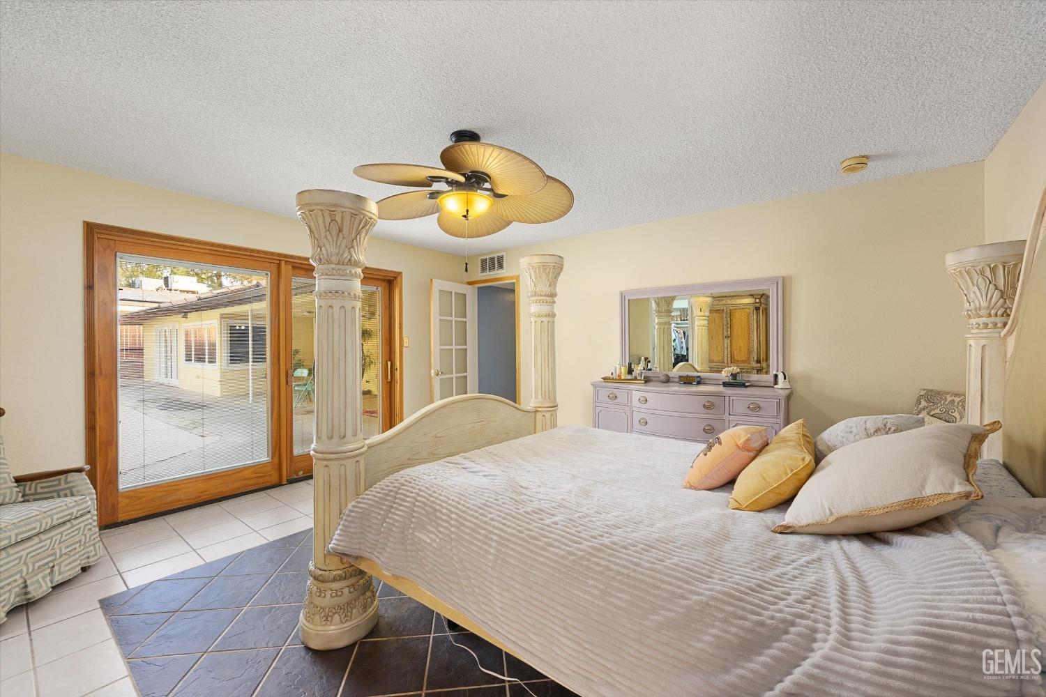 Undisclosed Address Bakersfield, CA 93306 - Photo 24 of 41 a bedroom with a bed and painting on the wall