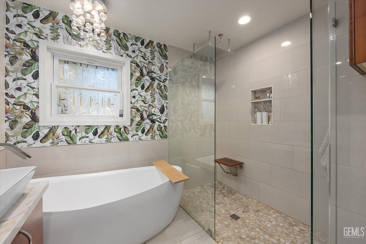 Undisclosed Address Bakersfield, CA 93306 - Photo 26 of 41 a bathroom with a bathtub and shower