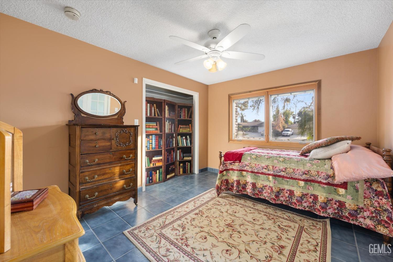 Undisclosed Address Bakersfield, CA 93306 - Photo 28 of 41 a bedroom with a bed and a dresser