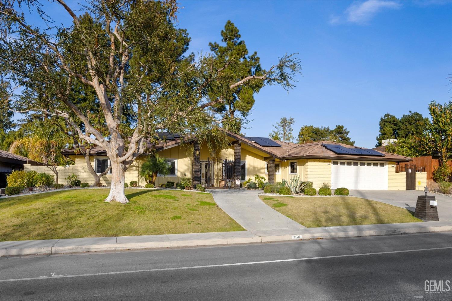 Undisclosed Address Bakersfield, CA 93306 - Photo 3 of 41 a view of a house with a yard