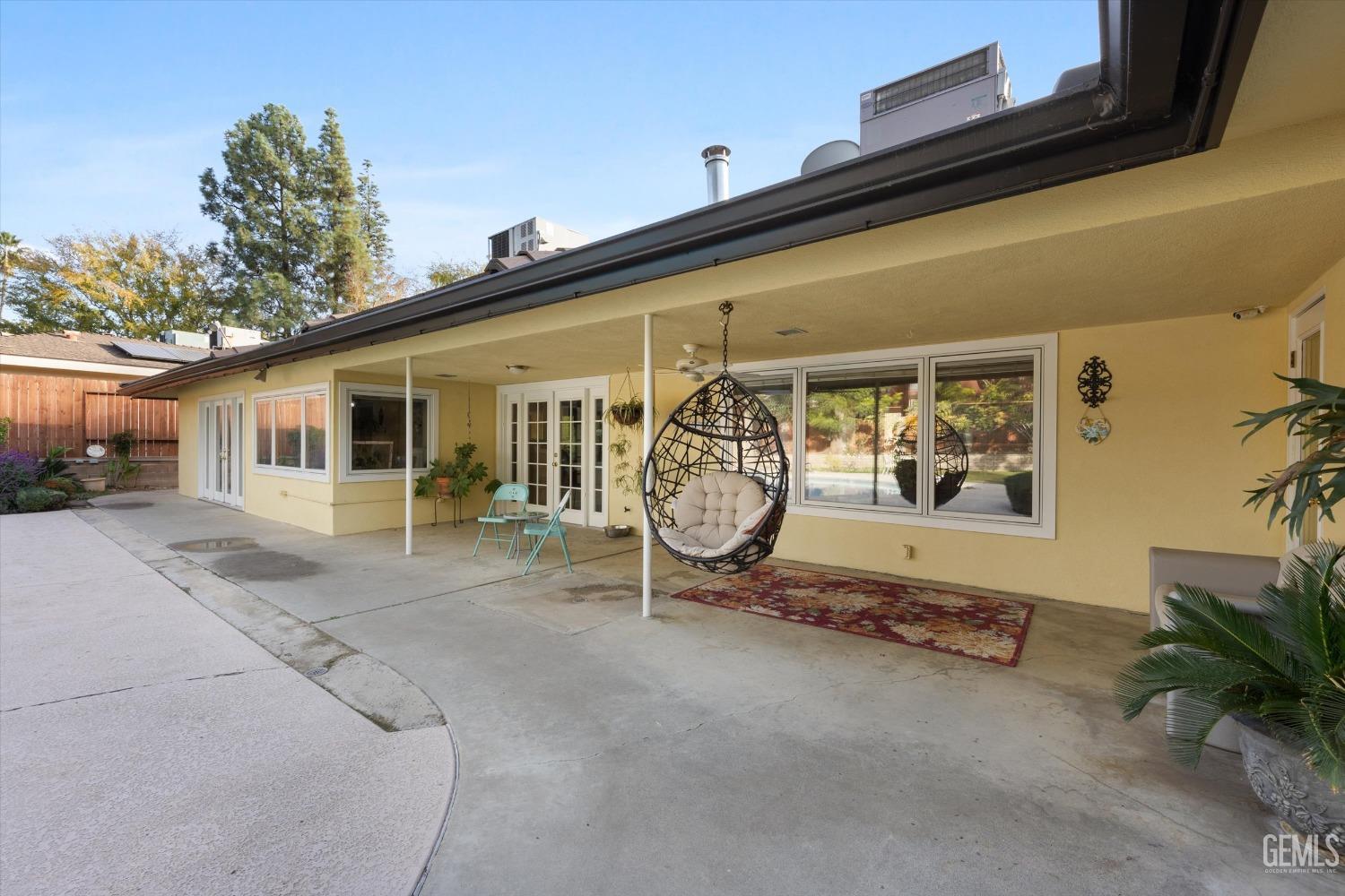 Undisclosed Address Bakersfield, CA 93306 - Photo 35 of 41 a view of a house with potted plants and a car parked