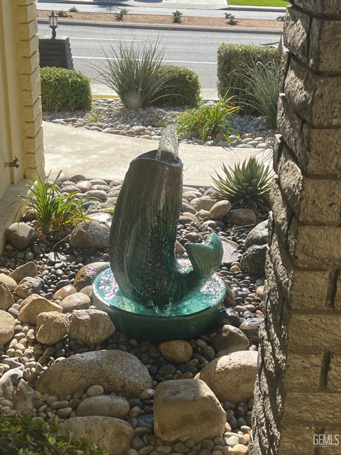 Undisclosed Address Bakersfield, CA 93306 - Photo 5 of 41 a view of a swimming pool with outdoor seating and plants