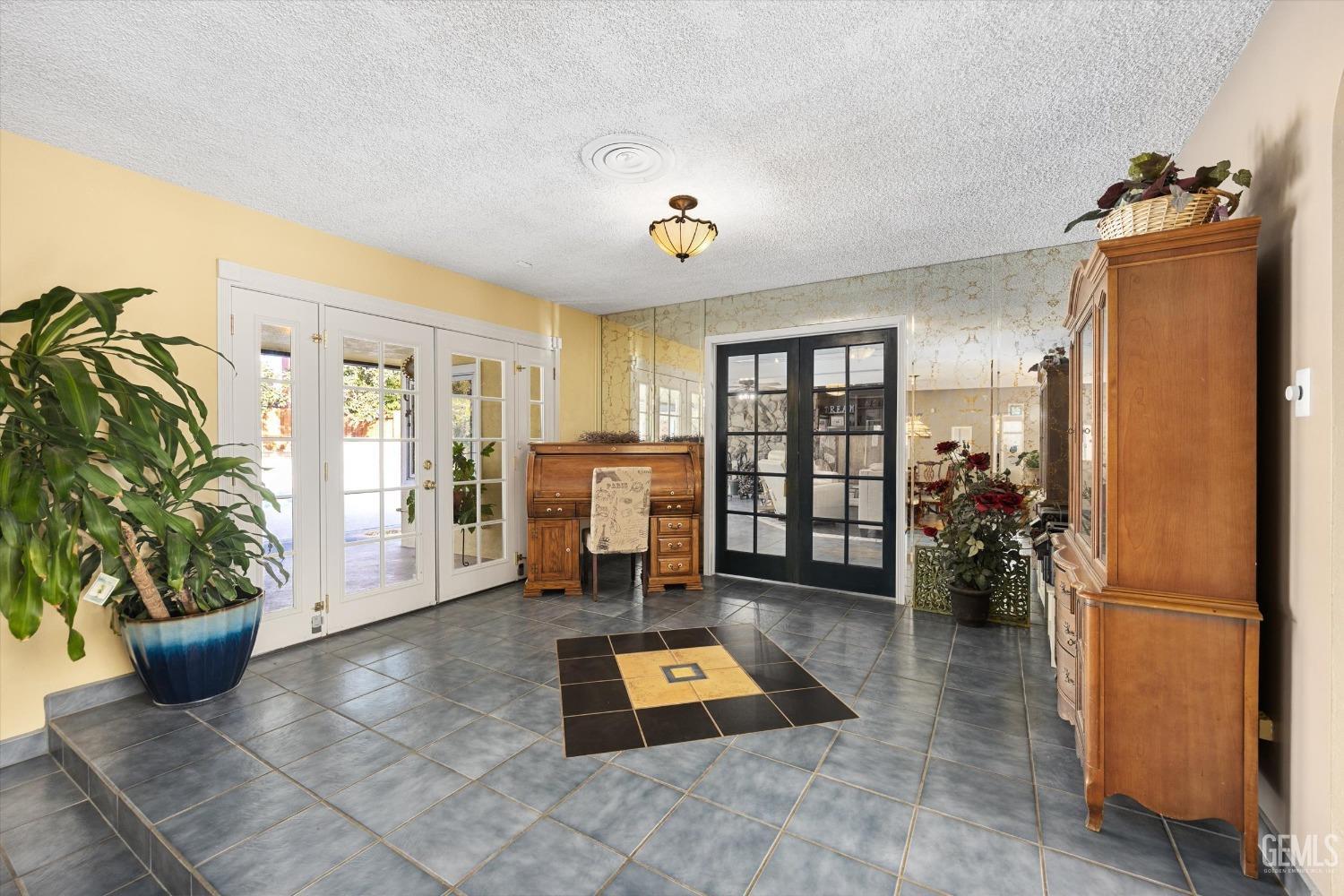Undisclosed Address Bakersfield, CA 93306 - Photo 7 of 41 a living room with furniture and a potted plant