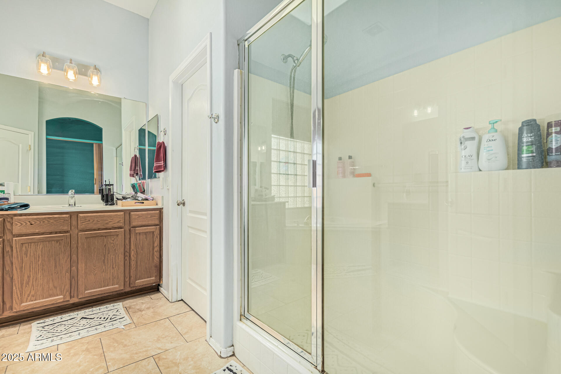 3318 West Latona Road Laveen, AZ 85339 - Photo 14 of 26 a bathroom with a double vanity sink and a mirror