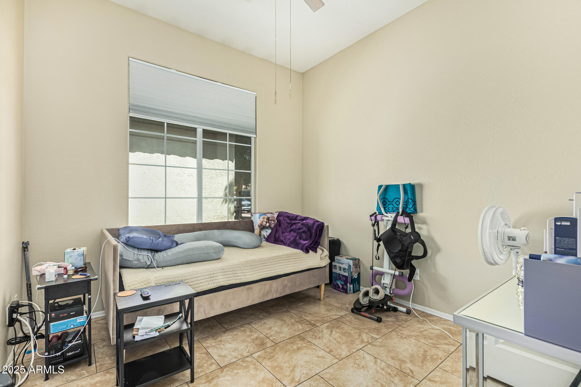 3318 West Latona Road Laveen, AZ 85339 - Photo 15 of 26 a bedroom with furniture and a window