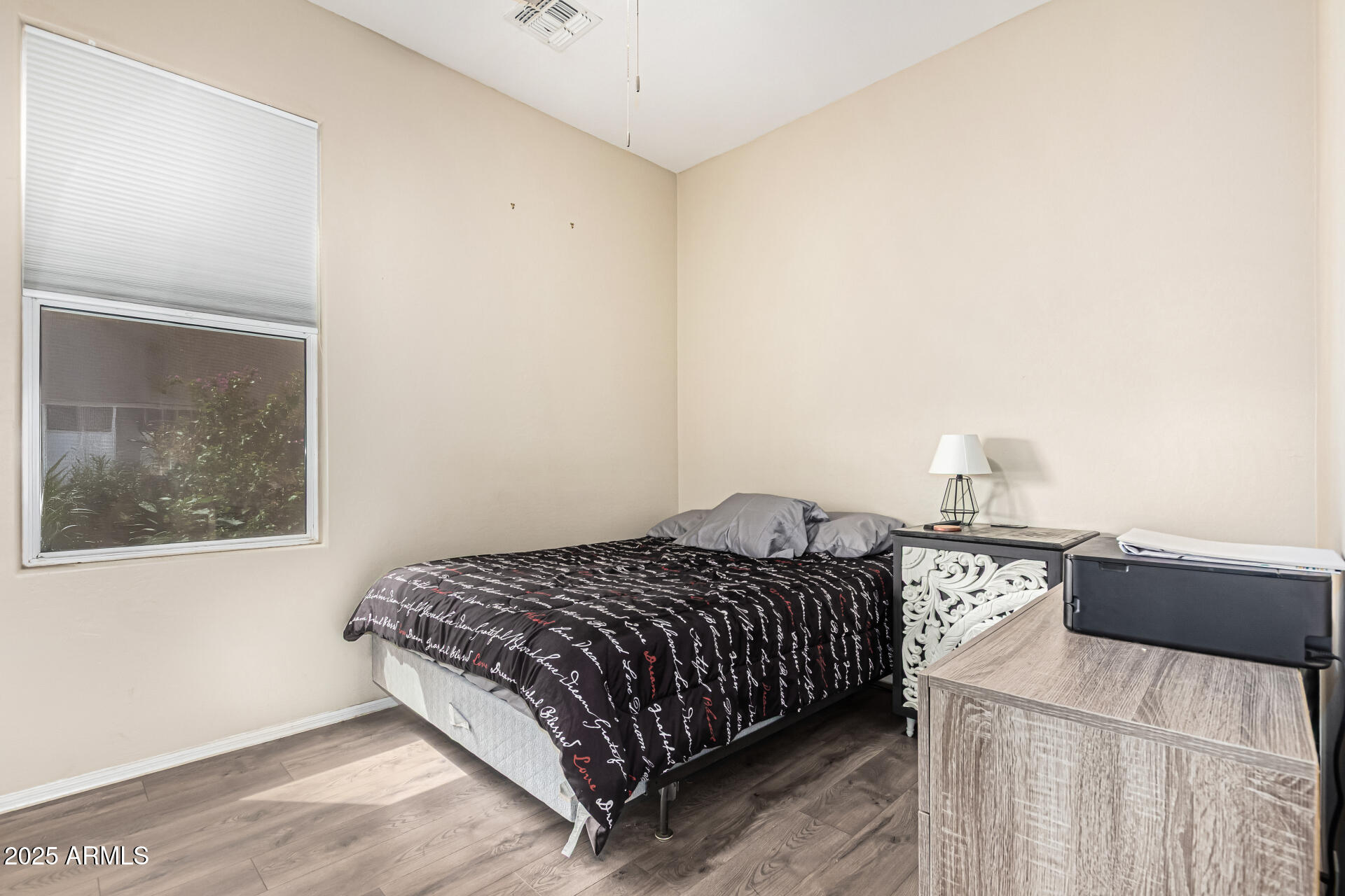 3318 West Latona Road Laveen, AZ 85339 - Photo 18 of 26 a bedroom with a bed and a window