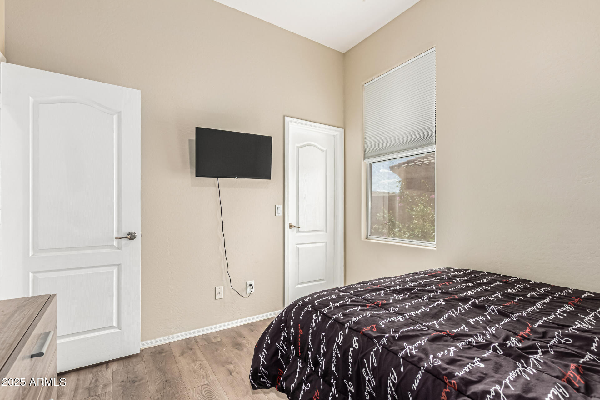 3318 West Latona Road Laveen, AZ 85339 - Photo 19 of 26 a bedroom with a bed and a window