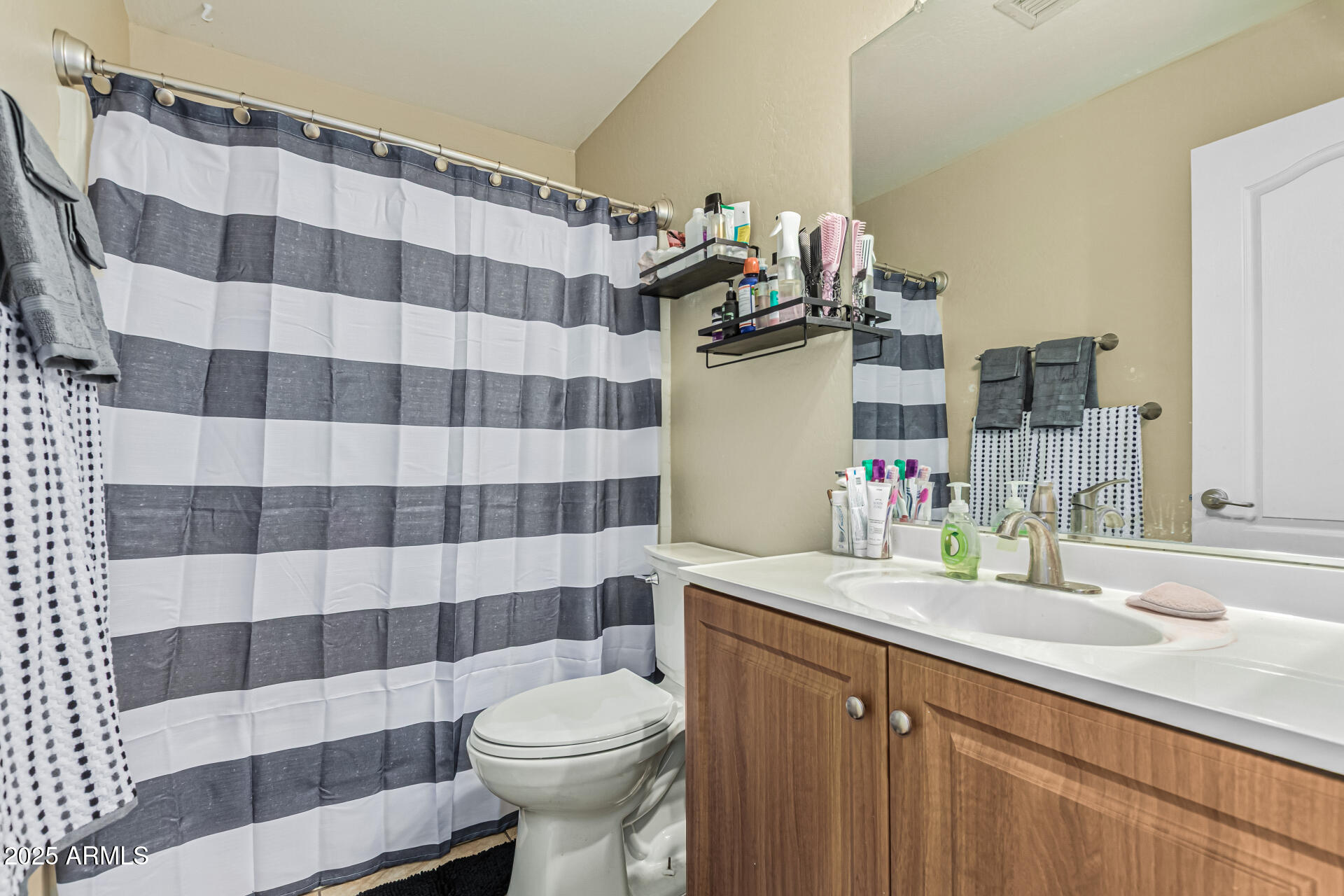 3318 West Latona Road Laveen, AZ 85339 - Photo 20 of 26 a bathroom with a sink toilet and shower