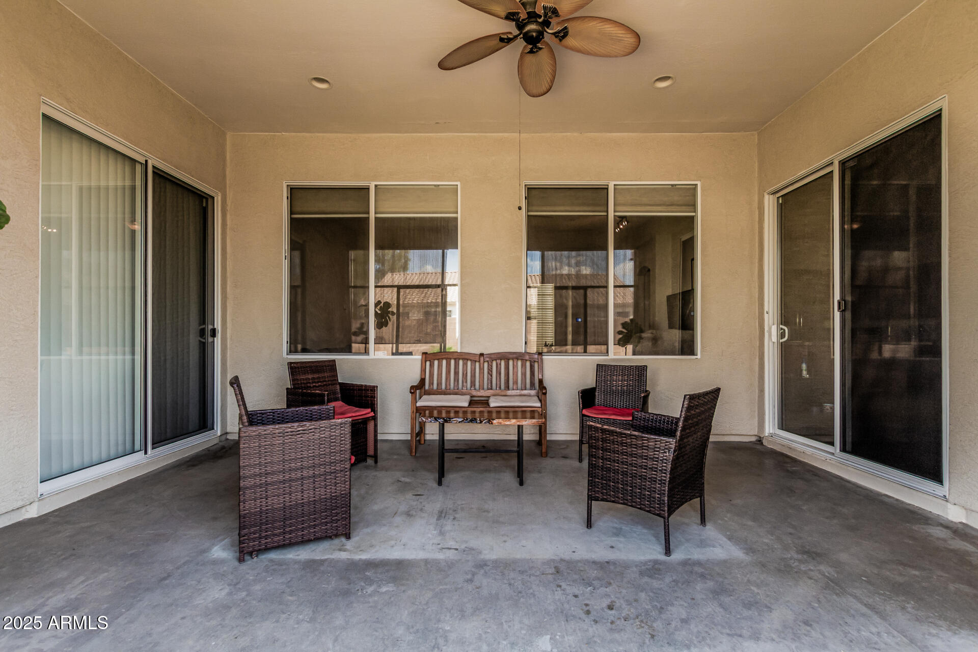 3318 West Latona Road Laveen, AZ 85339 - Photo 22 of 26 a living room with furniture a window and a ceiling fan