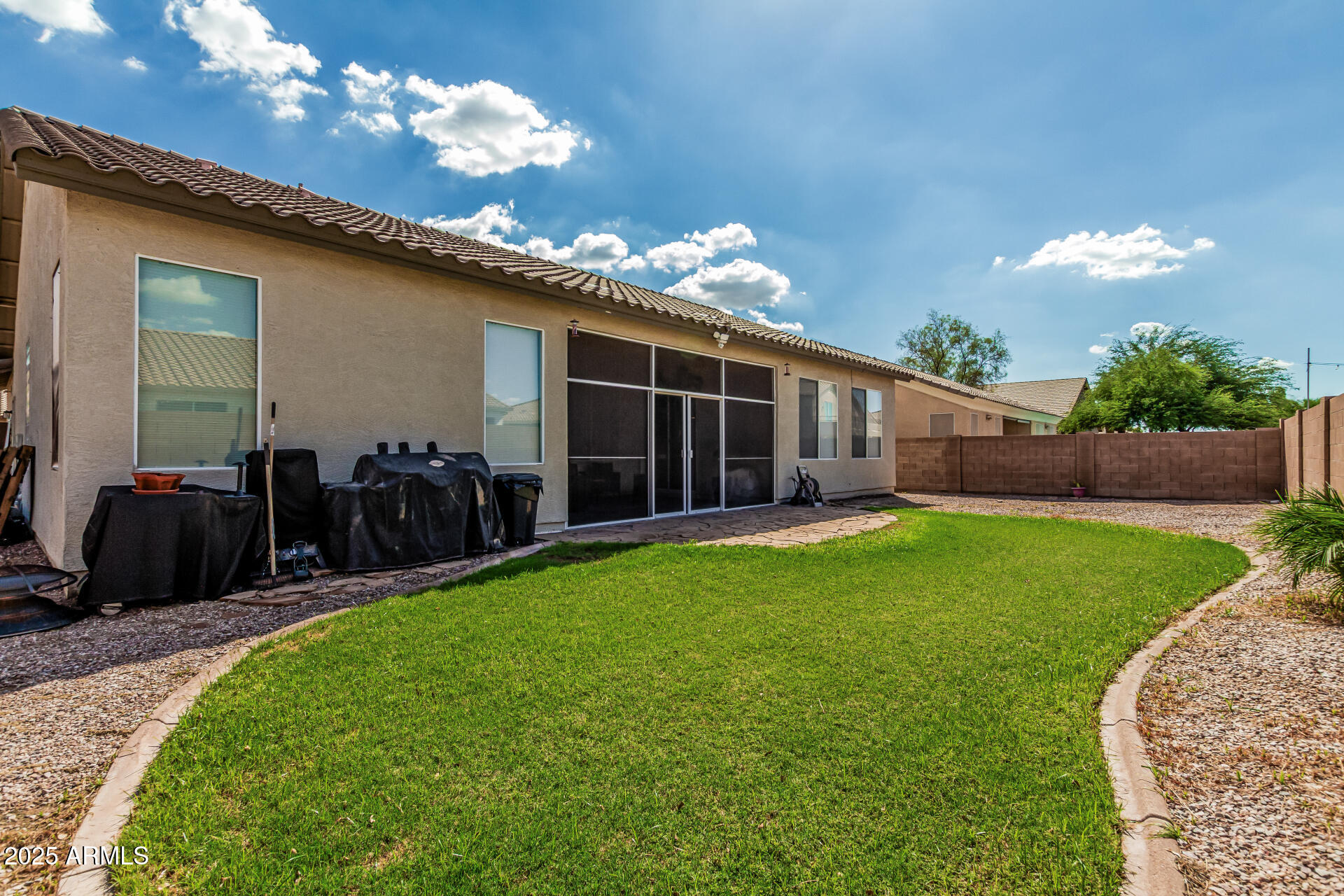 3318 West Latona Road Laveen, AZ 85339 - Photo 23 of 26 a view of a house with yard and a garden