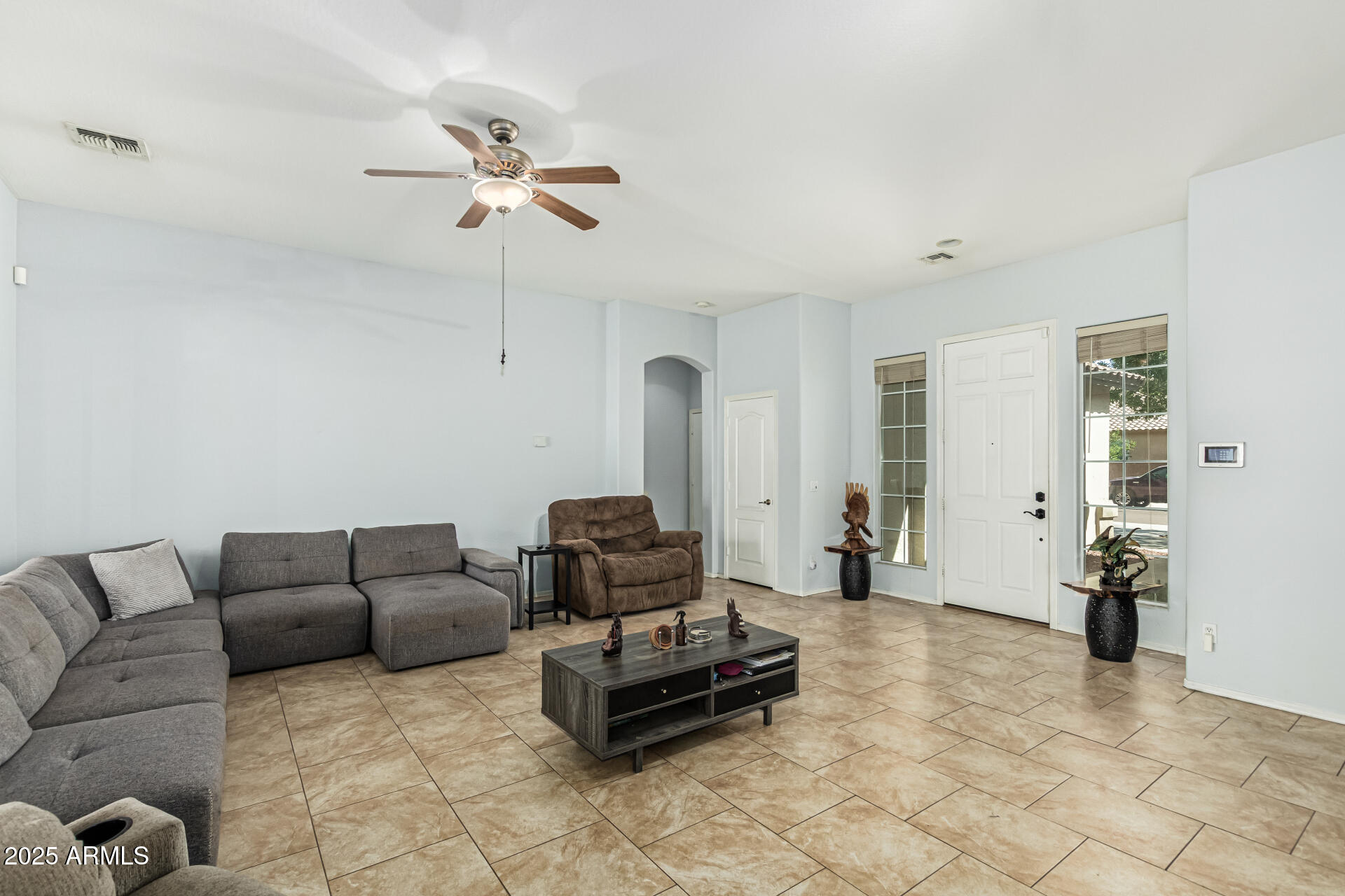 3318 West Latona Road Laveen, AZ 85339 - Photo 4 of 26 a living room with furniture