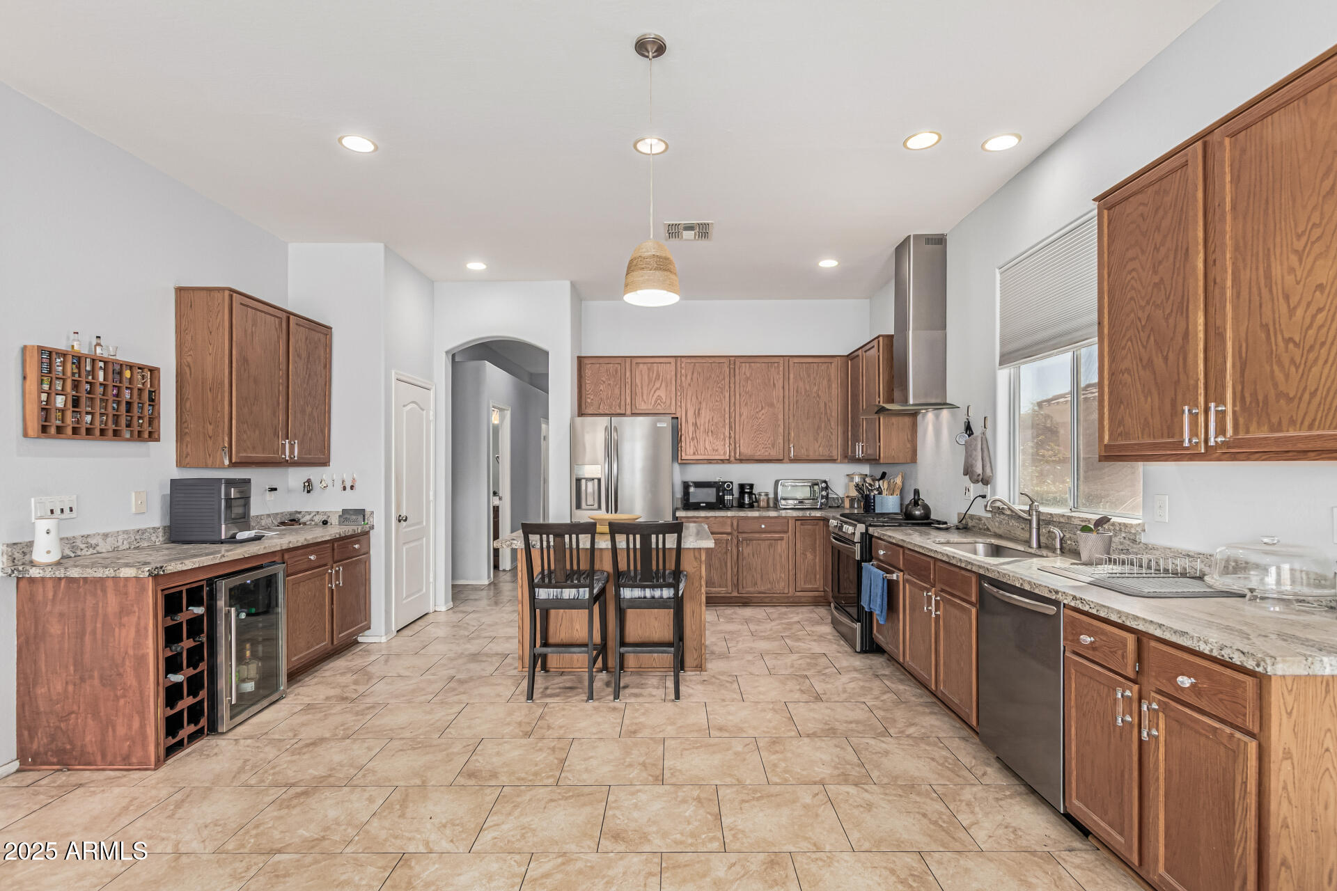 3318 West Latona Road Laveen, AZ 85339 - Photo 7 of 26 a large kitchen with stainless steel appliances lots of counter top space