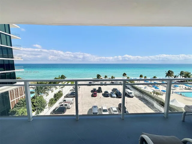 a view of a balcony with an ocean view