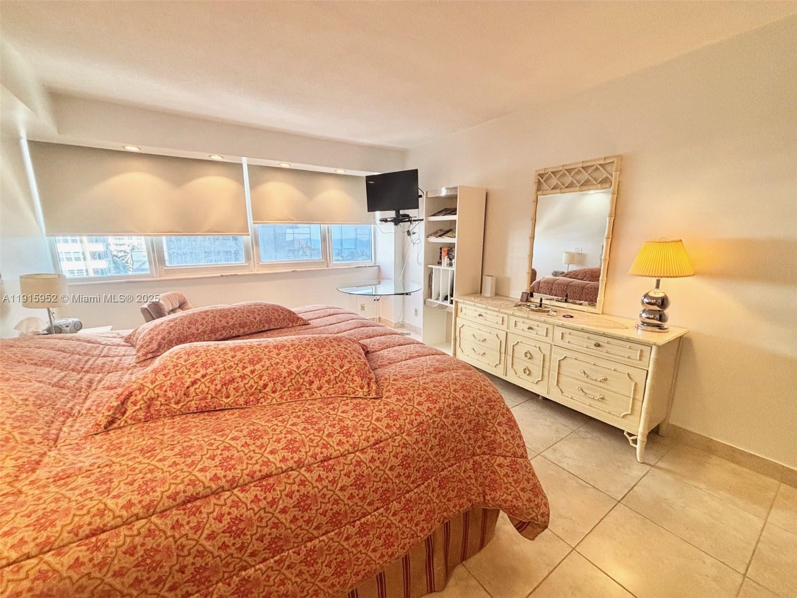 2030 South Ocean Drive, Unit 521 Hallandale Beach, FL 33009 - Photo 14 of 20 a large bedroom with a bed and large cabinets